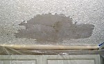 Acoustic texture removed from a ceiling, caused by water damage.