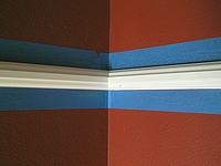Use blue masking to protect walls while brushing interior trim.