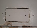 Piece of drywall installed over wood furring strip.