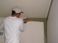 Cutting-in interior walls and ceiling.