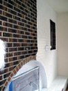 Fireplace brick being primed.