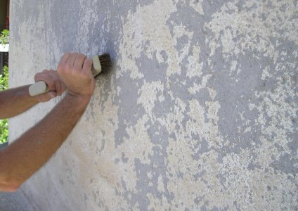 Preparing painted stucco for priming and painting.
