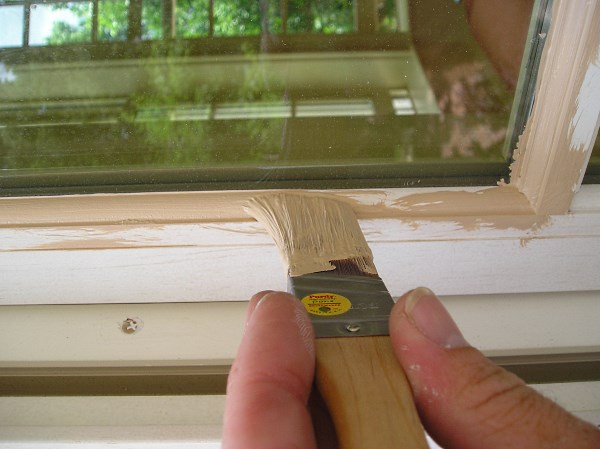Painting an exterior window sash.