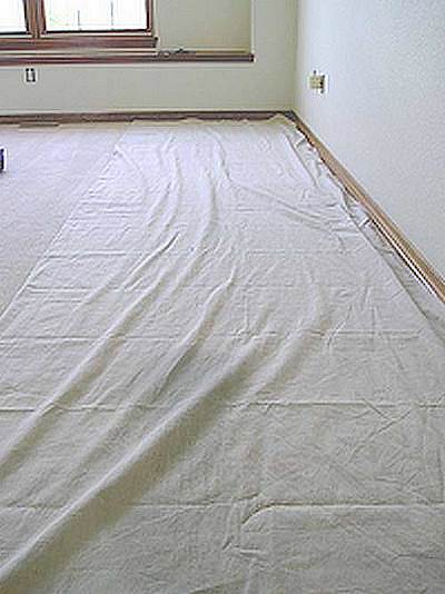 Drop cloth in use protecting floor.