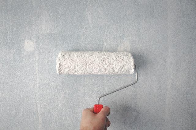 White paint brush on wall